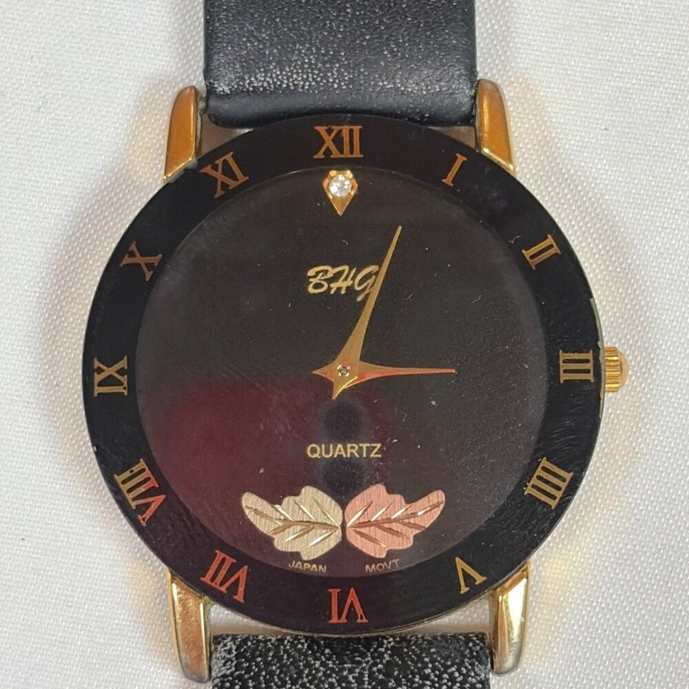 BHG Black and Gold Tone Leaf Design Roman Numerals 34mm Leather Band Wristwatch